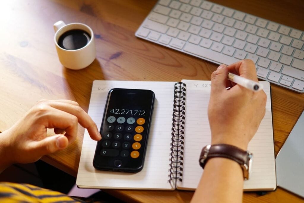 Close-up shot of entrepeneur using a calculator